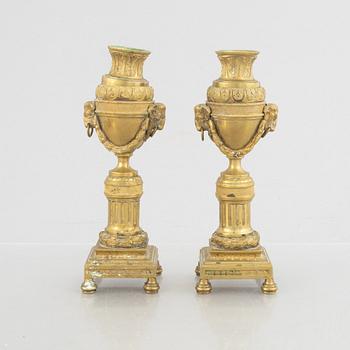 A pair of Louis XVI-style candlesticks, late 19th century.