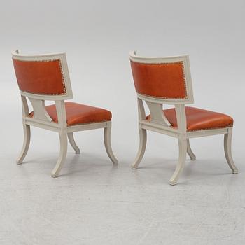 A pair of klismos armchairs, circa 1900.