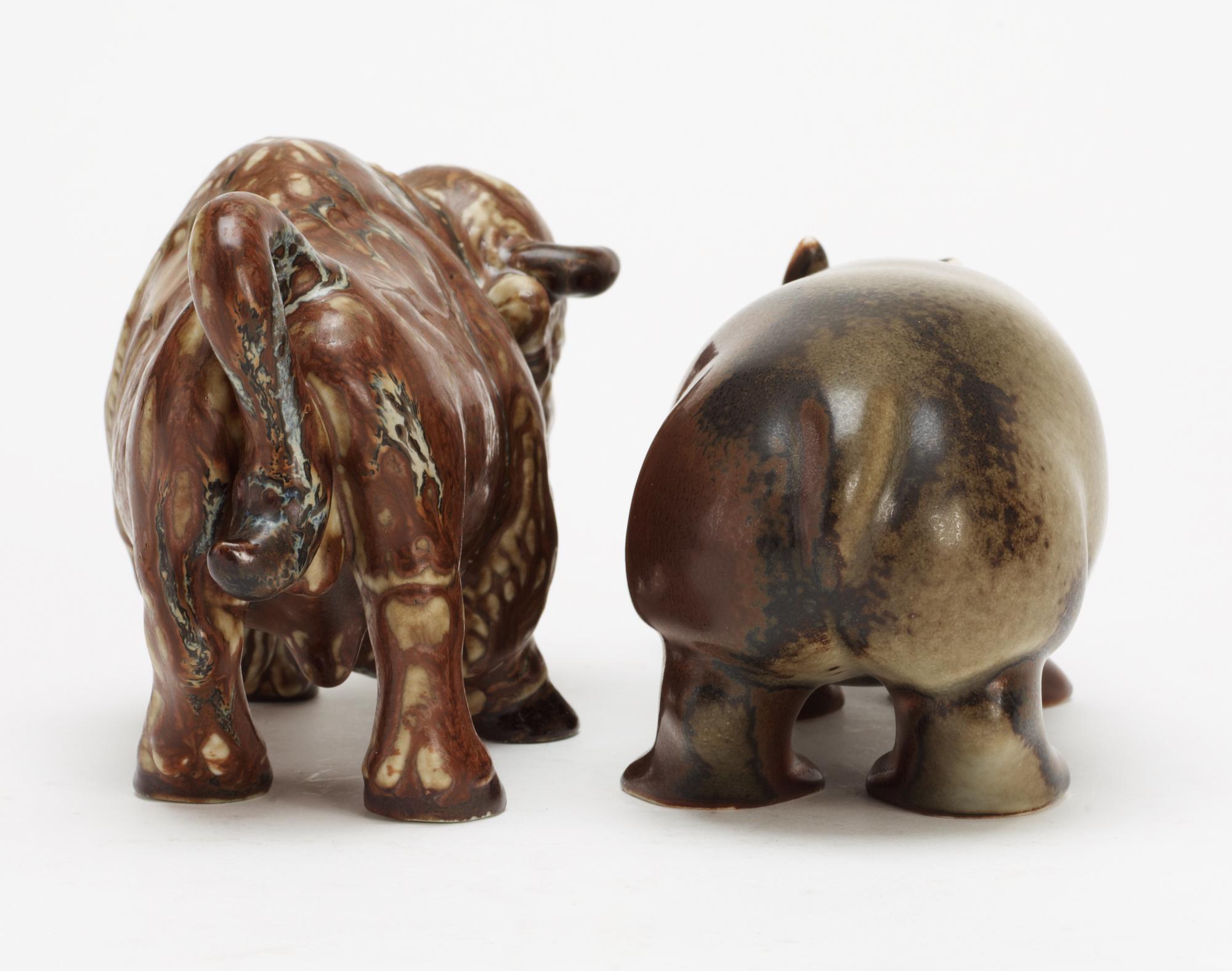 Two Gunnar Nylund stoneware figures, a bison and a hippo, Rörstrand.
