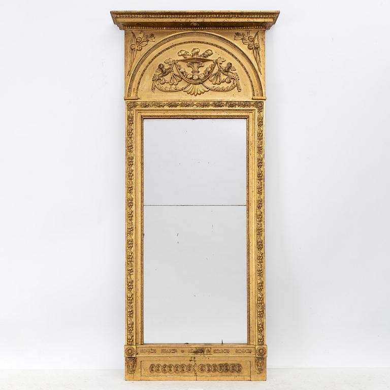 Empire, A late Empire mirror, first half of the 19th century.