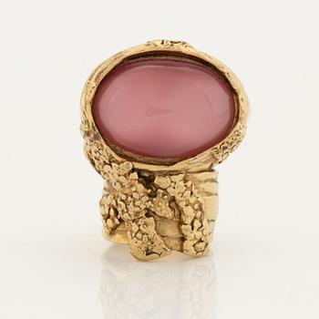 An Yves Saint Laurent ring.