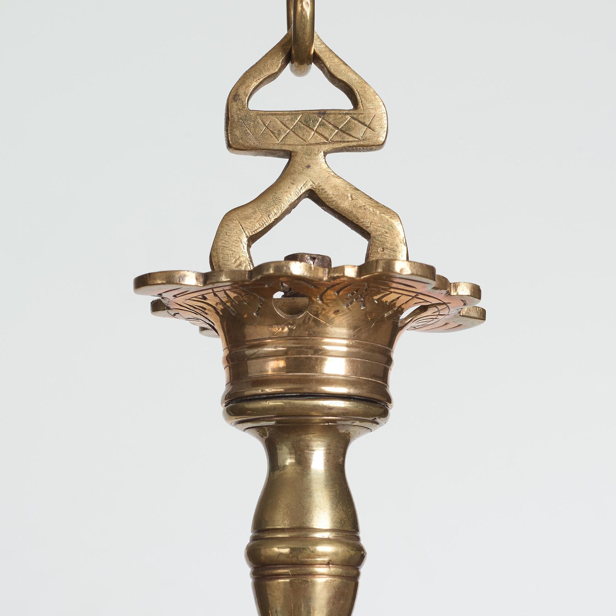A six-light 18/19th century brass chandelier.