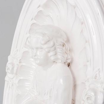 A ceramic wall relief, circa 1900.