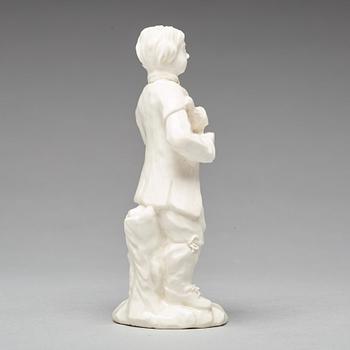 A Swedish Marieberg soft paste figure of a man with a bird, 18th Century.