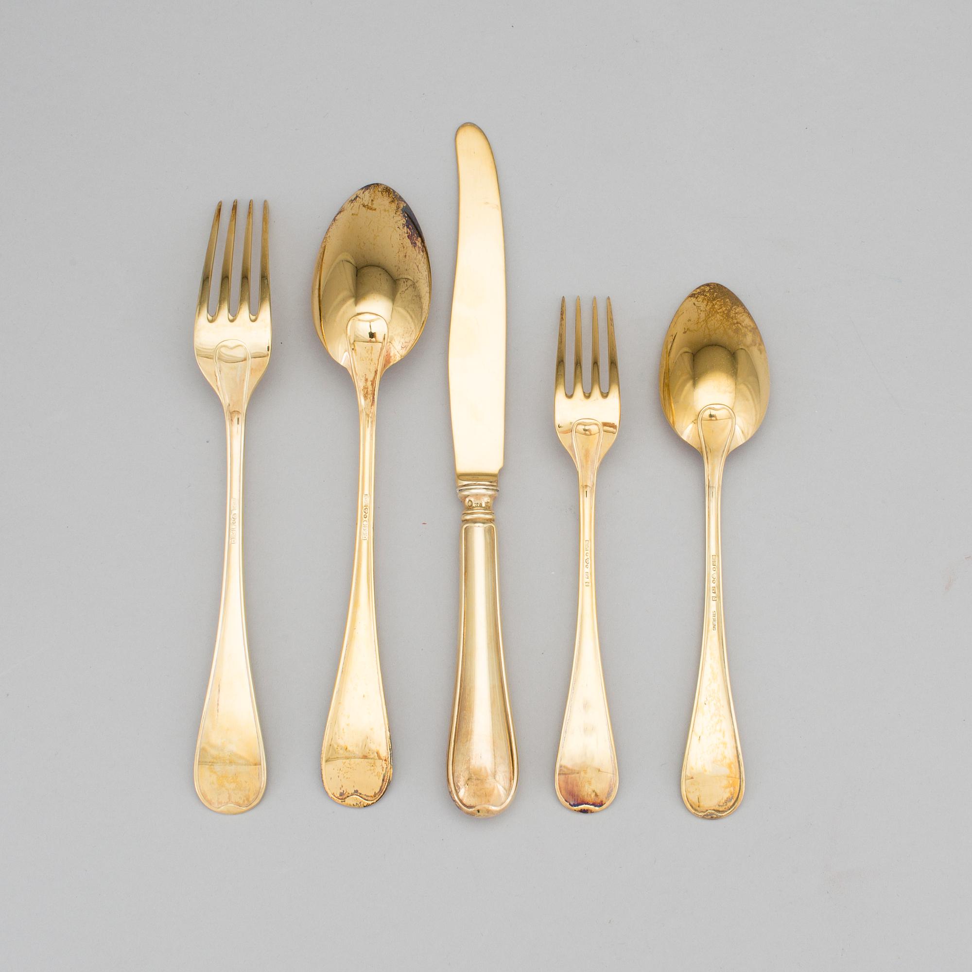 A set of 60 pieces of cutlery gilded sterling silver by CG Hallberg in Stockholm 1957-1961. Total weight c. 3950 gram.
