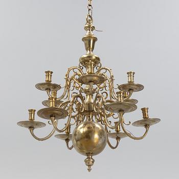 A brass Baroque style chandelier, 20th Century.
