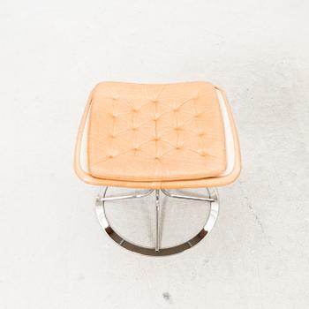 A Bruno Mathsson Jetson leather easy chair and stool later part of the 20th century.