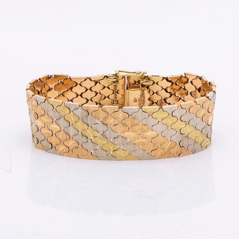A trois couleurs 18K gold bracelet weight 59,4 gram.