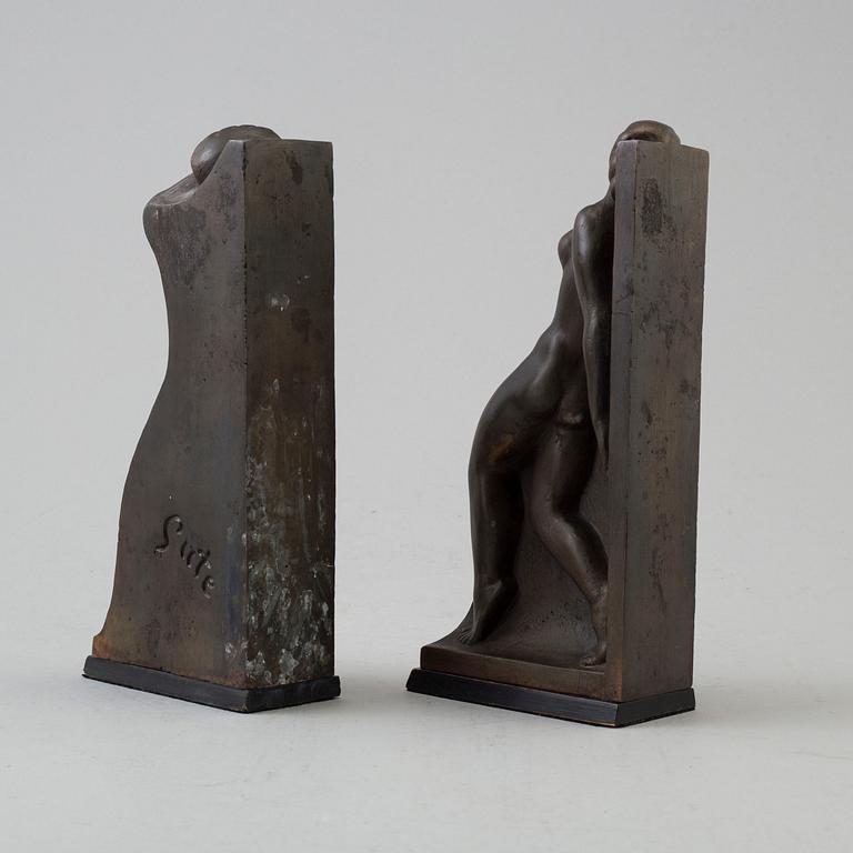 A pair of circa 1920 bronze book ends by Axel Gute, signed.