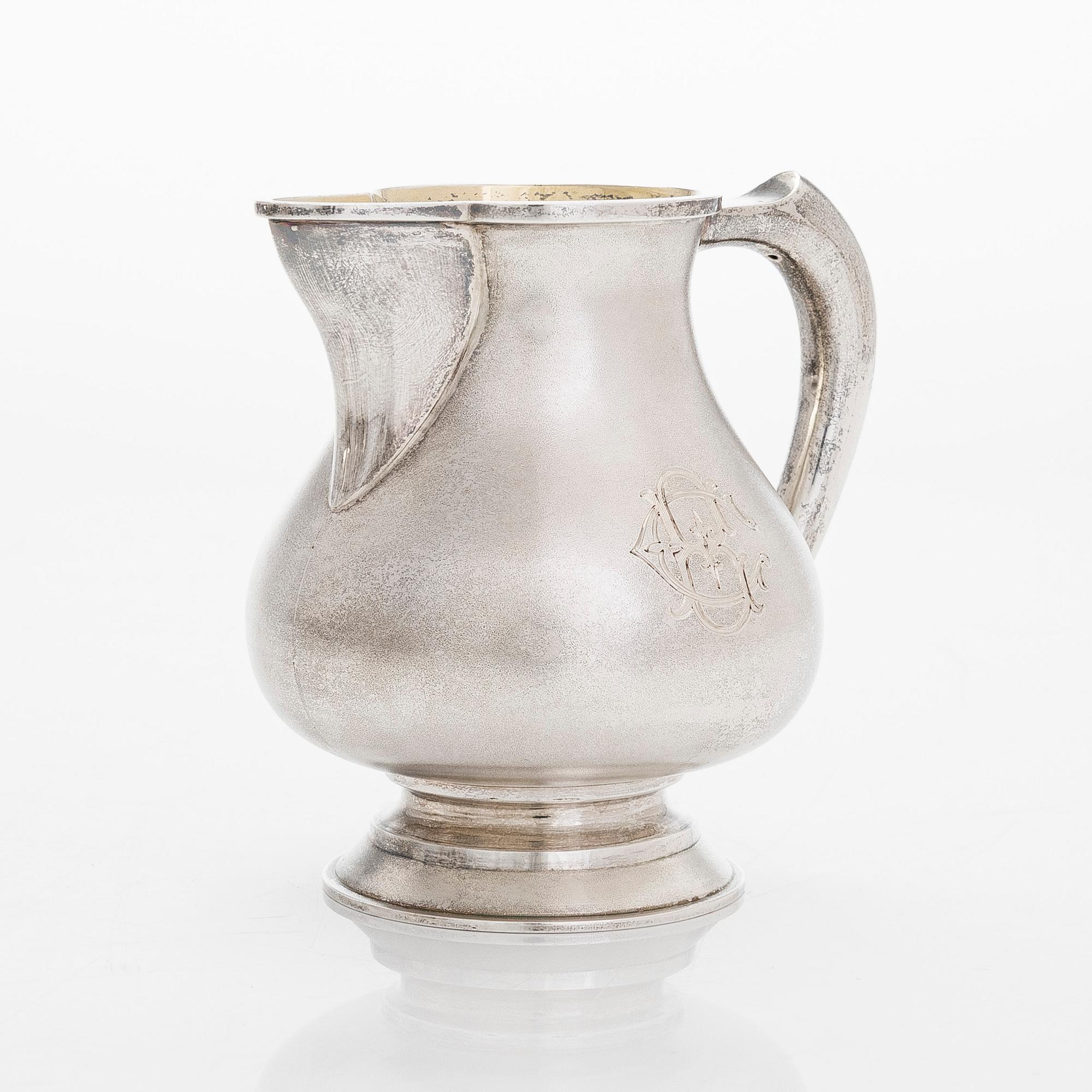 A four-piece silver coffee set, St. Petersburg 1887, original fitted box from Khlebnikov. Sugar tong, Moscow around 190.