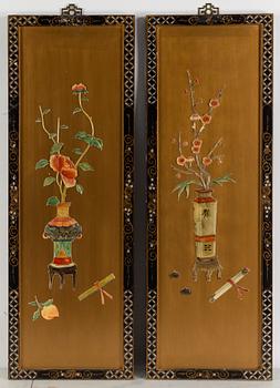 A pair of Chinese wooden panels with stone inlays.