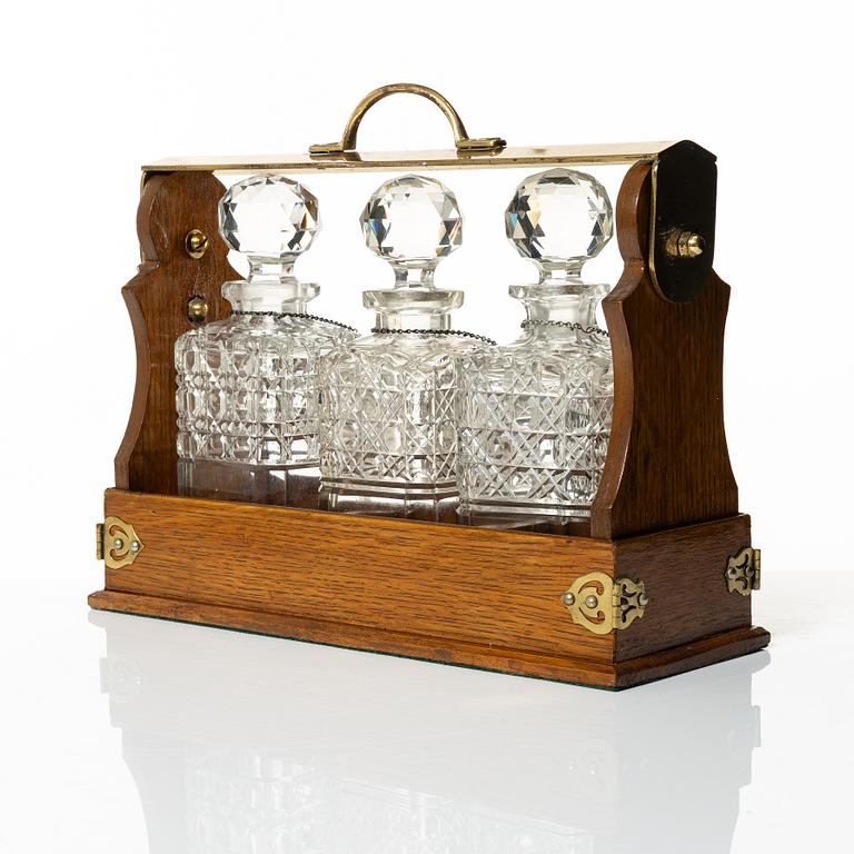A wooden box with three glass flasks, Birmingham, circa 1900.