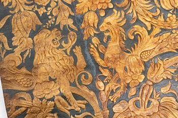A 19th century wrought leather wallpaper, ca 388 x 97 cm.