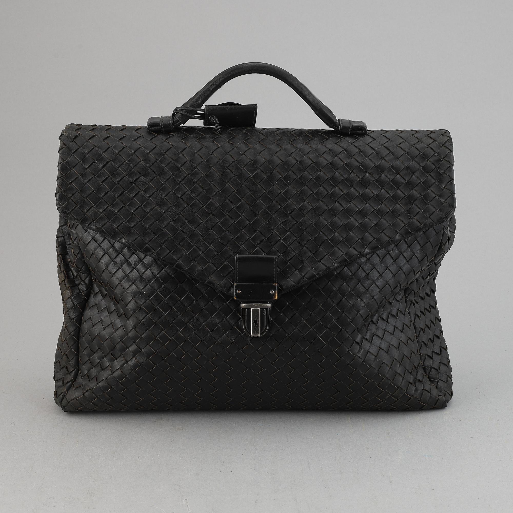 Bottega Veneta, a black intrecciato leather briefcase.