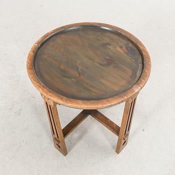 An oak and brass table first half of the 20th century.