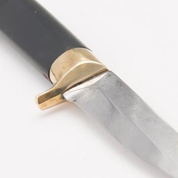 A 1970s Finnish puukko knife in stainless steel, nylon and brass designed by Tapio Wirkkala, Lapin Puukko.