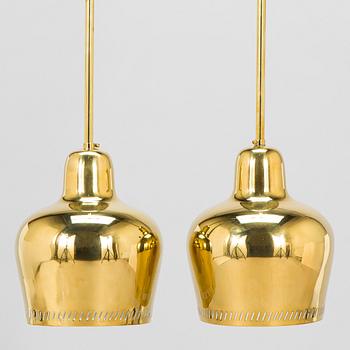 Paavo Tynell, a pair of mid 20th century ceiling lights, model 1699, for Taito / Idman.