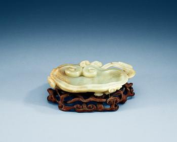 1566. A large pale celadon nephrite brush washer with a wooden stand, Qing dynasty.
