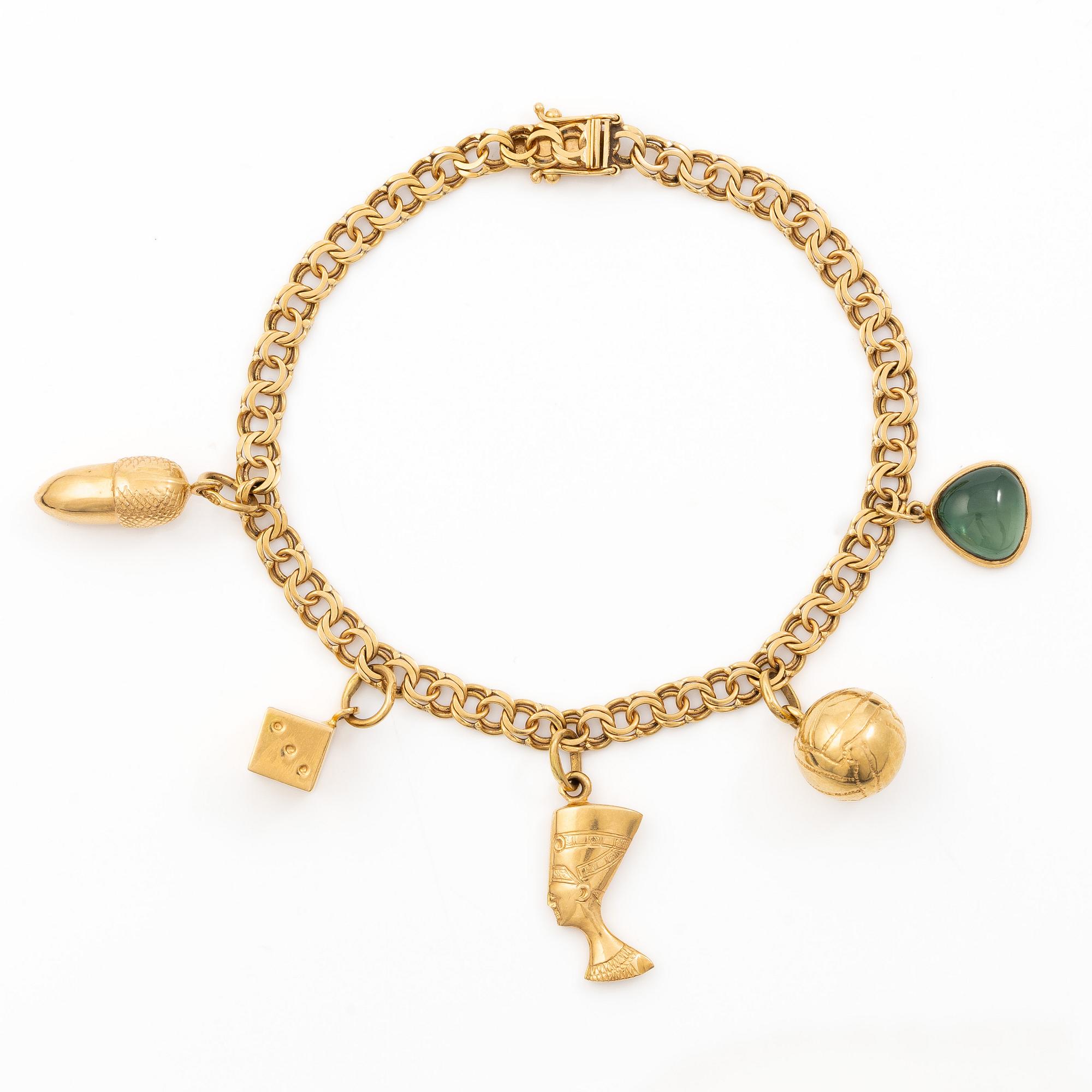 Bracelet 18K gold with five charms.