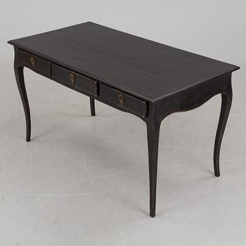 A partially rococo, 18th century writing desk.