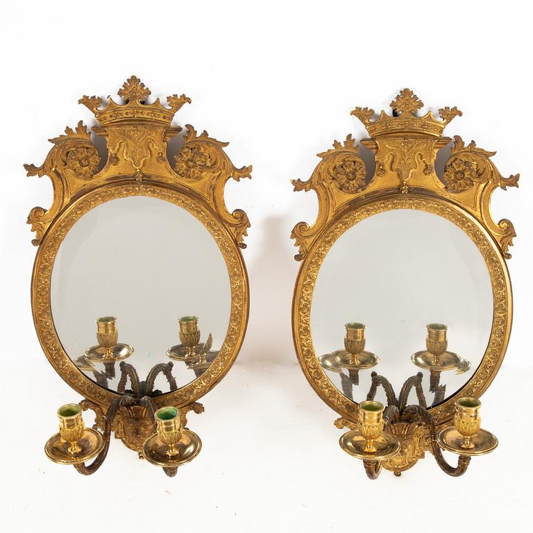 A pair of French Louis XIV-style ormolu two-light girandoles, after a model by Daniel Marot (1661-1752).