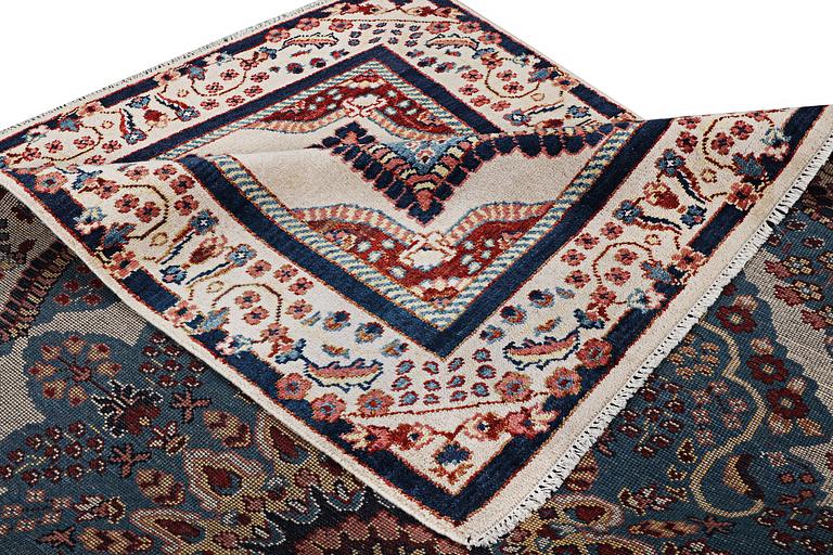 An oriental carpet with Mamluk design, c. 300 x 242 cm.