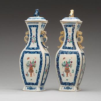A pair of famille rose vases with cover, Qing dynasty, Qianlong (1736-95).