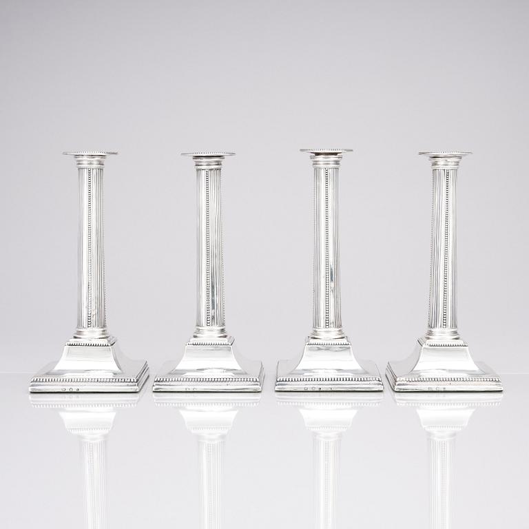 Four English 18th century silver candlesticks, mark of Young, Greaves & Hoyland, Sheffield 1780.