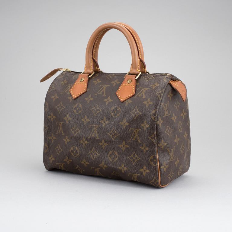 A Louis Vuitton "Speedy 25" hand bag.