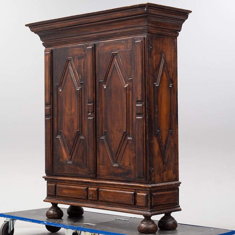 A first half of the 18th Century Baroque stained pine cabinet.