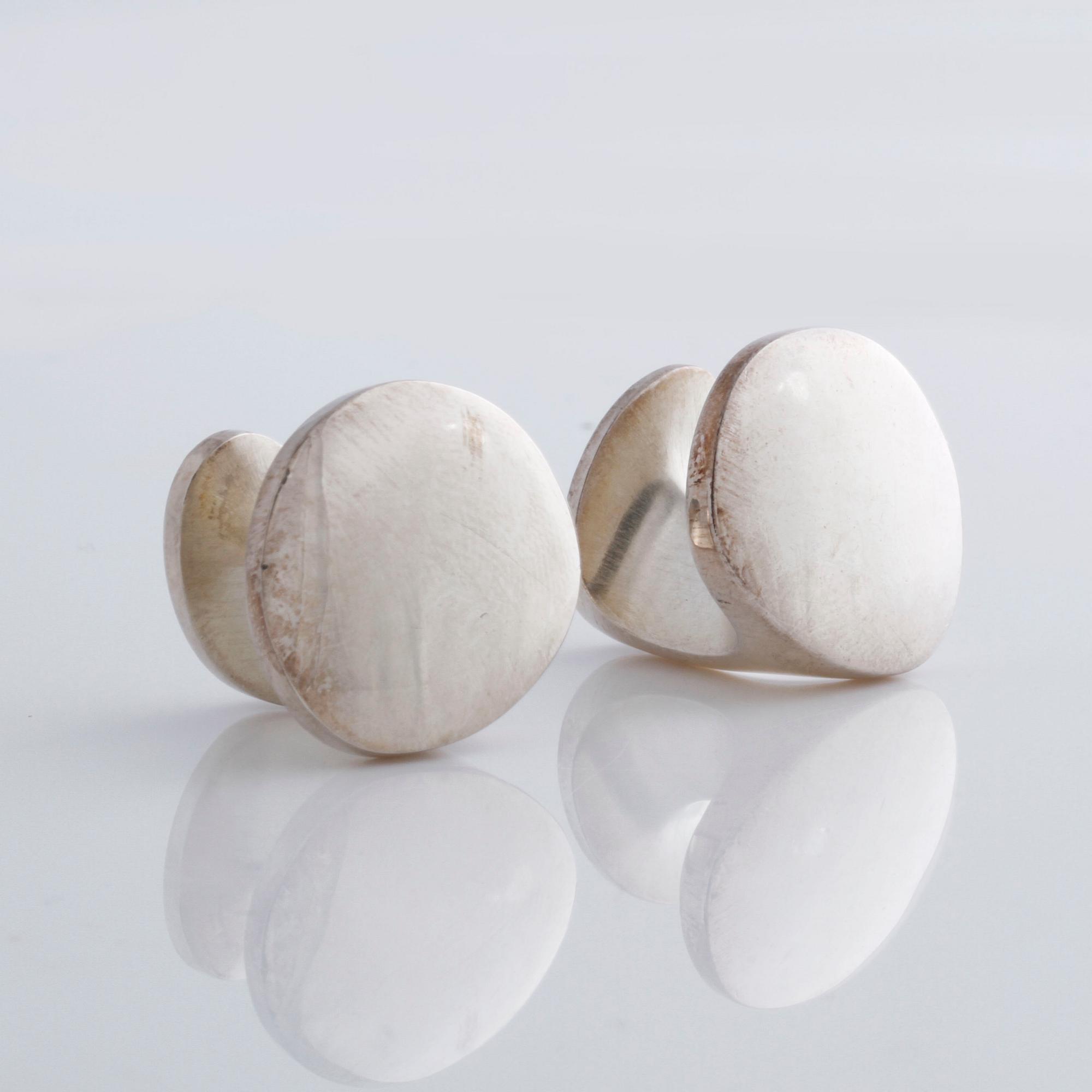 A pair of cufflink, by Ole Lynggaard.