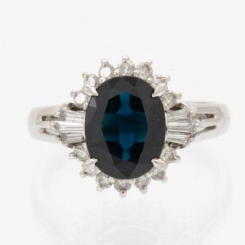 Ring, Platinum 850 with brilliant and tapered baguette cut diamonds and an oval faceted sapphire.