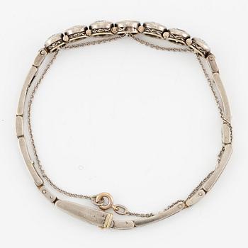 A bracelet in 14K white gold set with old-cut diamonds.