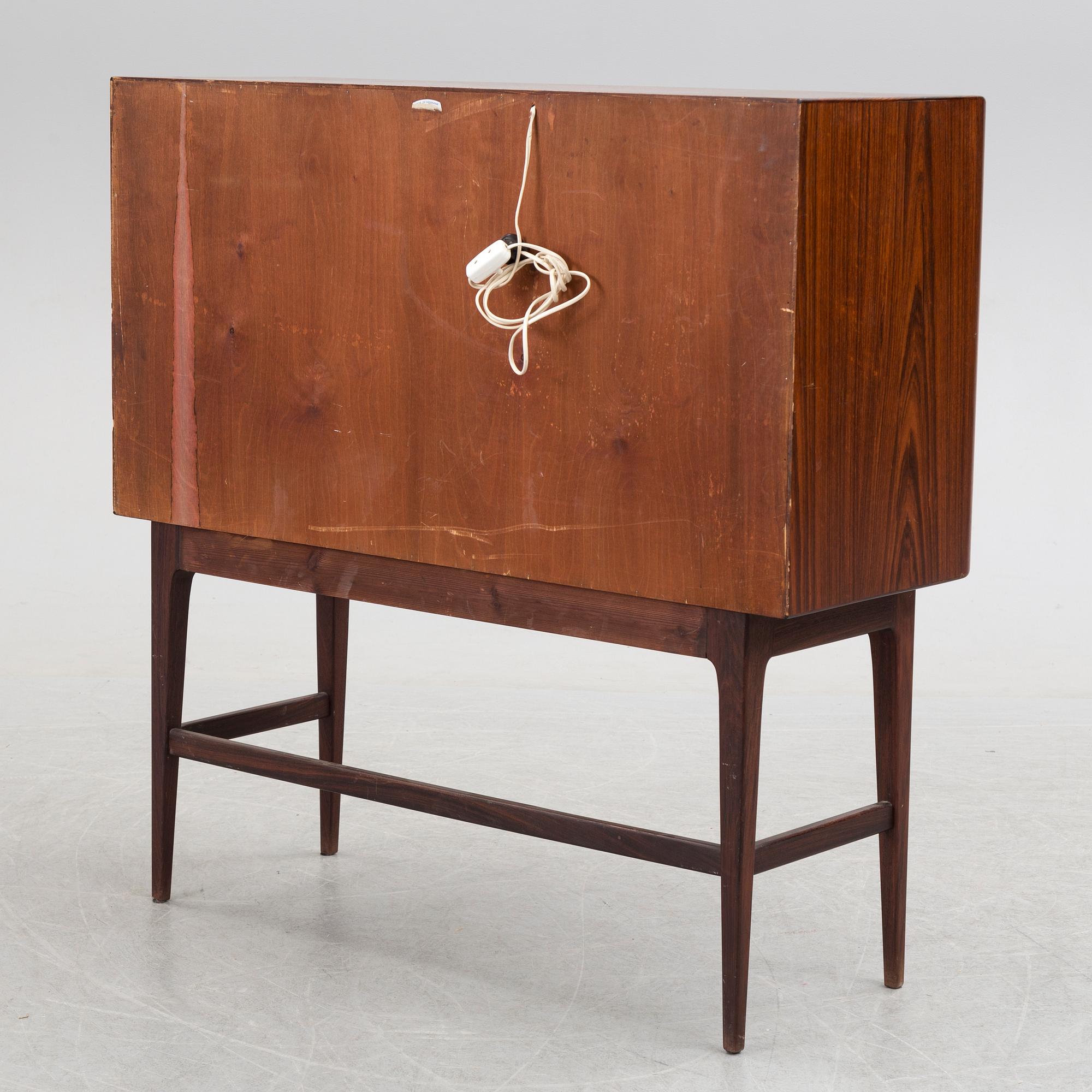 KURT ØSTERVIG, a Danish rosewood veneered drinks cabinet, 1960's.