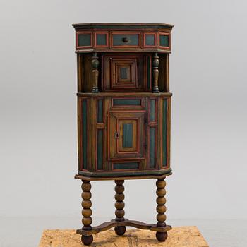 A 18th century corner cabinet.