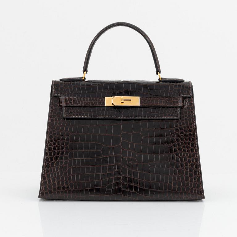 Hermès, A brown Alligator Mississippiensis "Kelly 28", 1964.