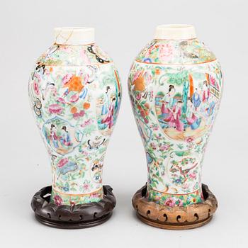 A pair of Famille Rose Canton vases mounted as lamps, Qing dynasty, 19th Century.