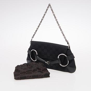 A Black GG Canvas Horsebit Clutch.