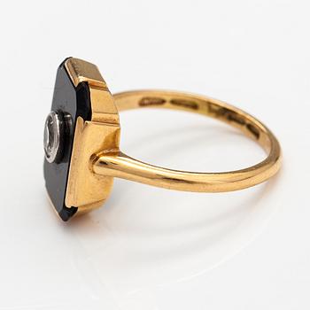 An 1(K gold ring with an onyx and an old-cut diamond ca. 0.18 ct. Westerback, Helsinki 1938.