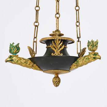 An Empire ormolu and patinated bronze four-light chandelier, Stockholm, early 19th century.