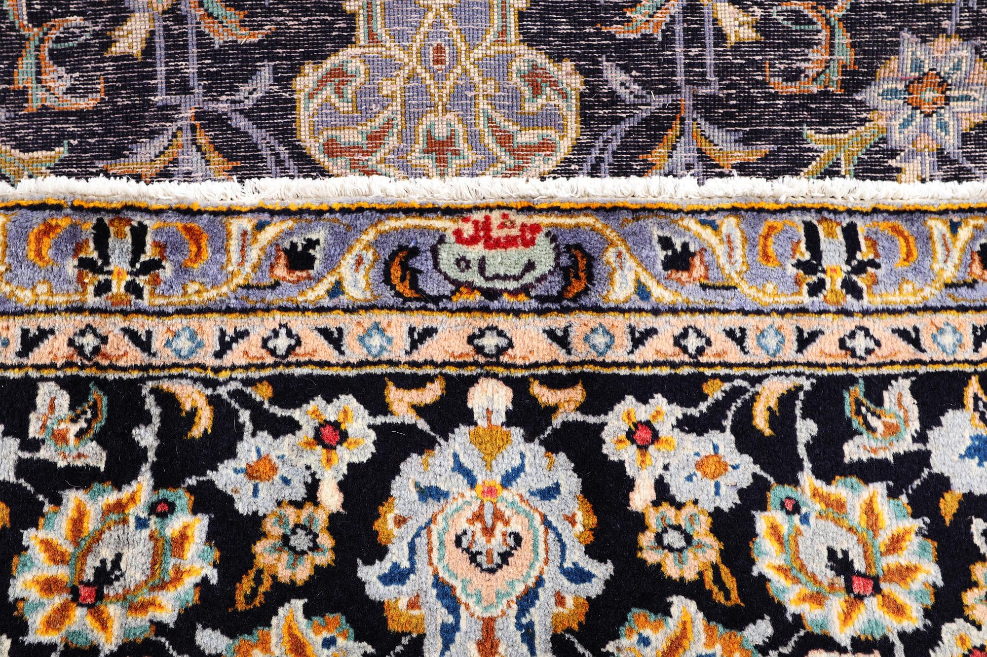 A Kashan carpet, signed, c. 410 x 270 cm.