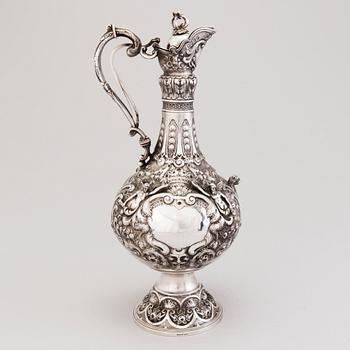 A silver wine jug, mark of J. Aldwinckle &  J. Slater, London 1881.