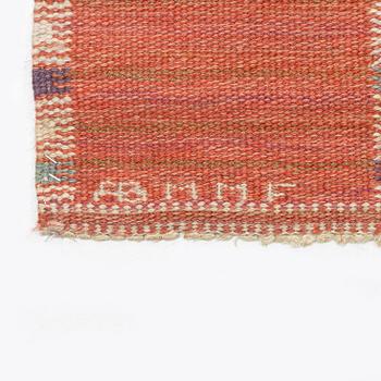 Barbro Nilsson, a carpet, 'Falurutan, röd Borås', flat weave, c. 502 x 212 cm, signed AB MMF BN.