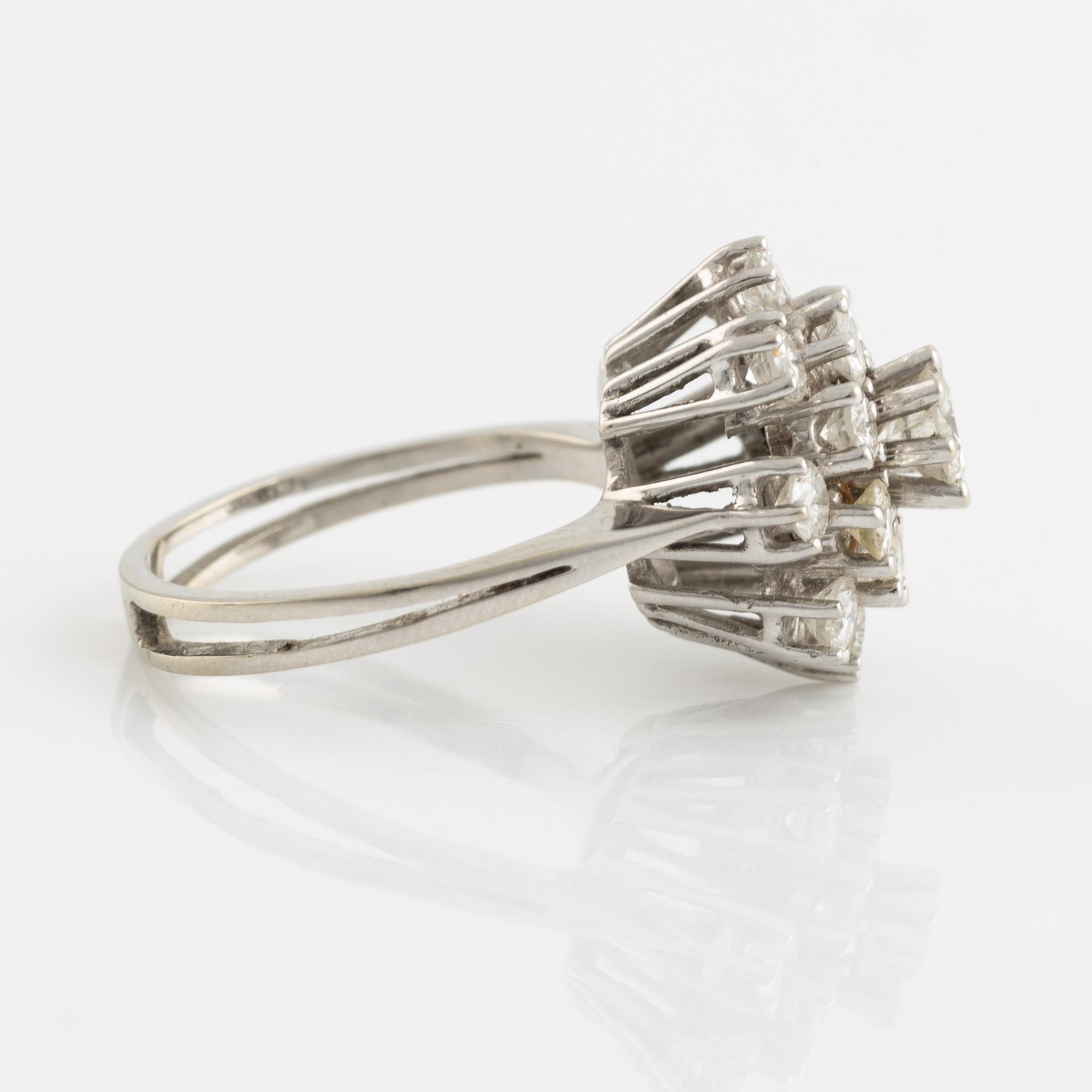 14K white gold and brilliant cut diamond cluster ring.