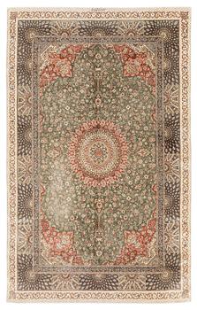 377. A silk Qum, Central Persia. signed Mohammad Gamshidi, c. 203 x 126 cm.