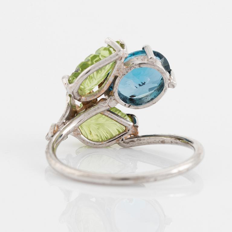 Blue topaz, carved peridot leaf, brilliant cut diamond ring.