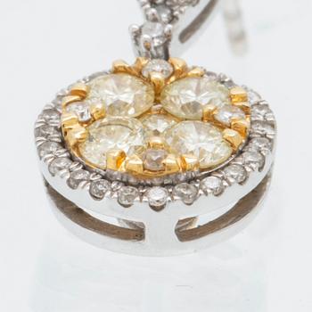 Earrings in 14K white and red gold with round brilliant-cut diamonds.