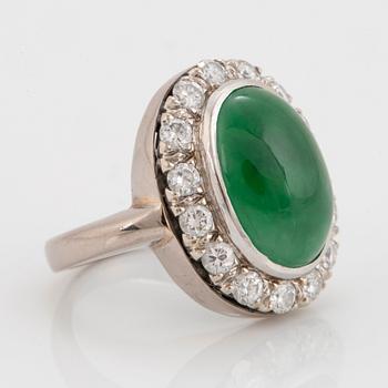 A jade and round brilliant-cut diamonds with a total weight of circa 0.60 ct.