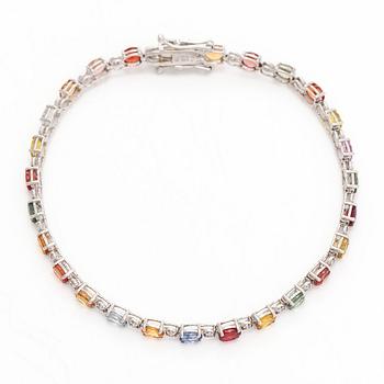 Rannekoru, 18K valkokultaa, monivärisillä safiireilla ja timanteilla.