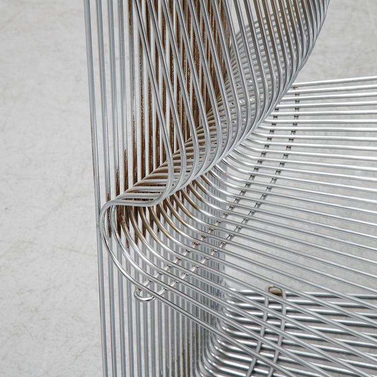 A 'Pantanova convex' chair with foot stool and a 'Wire Extendted' shelf, Verner Panton, Montana, Denmark.